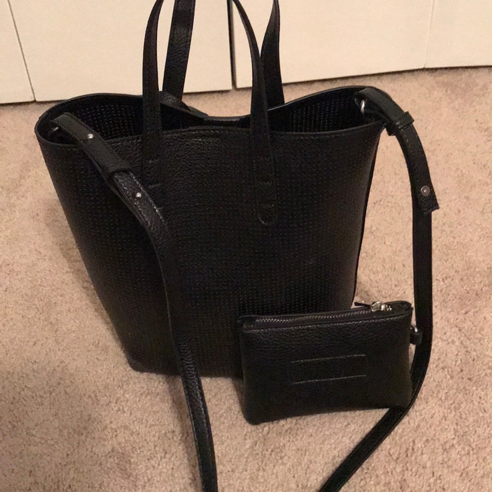 Woman’s black AE tote with matching coin purse